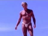 Tanned guy on beach in tiny string thong (temporarily!)